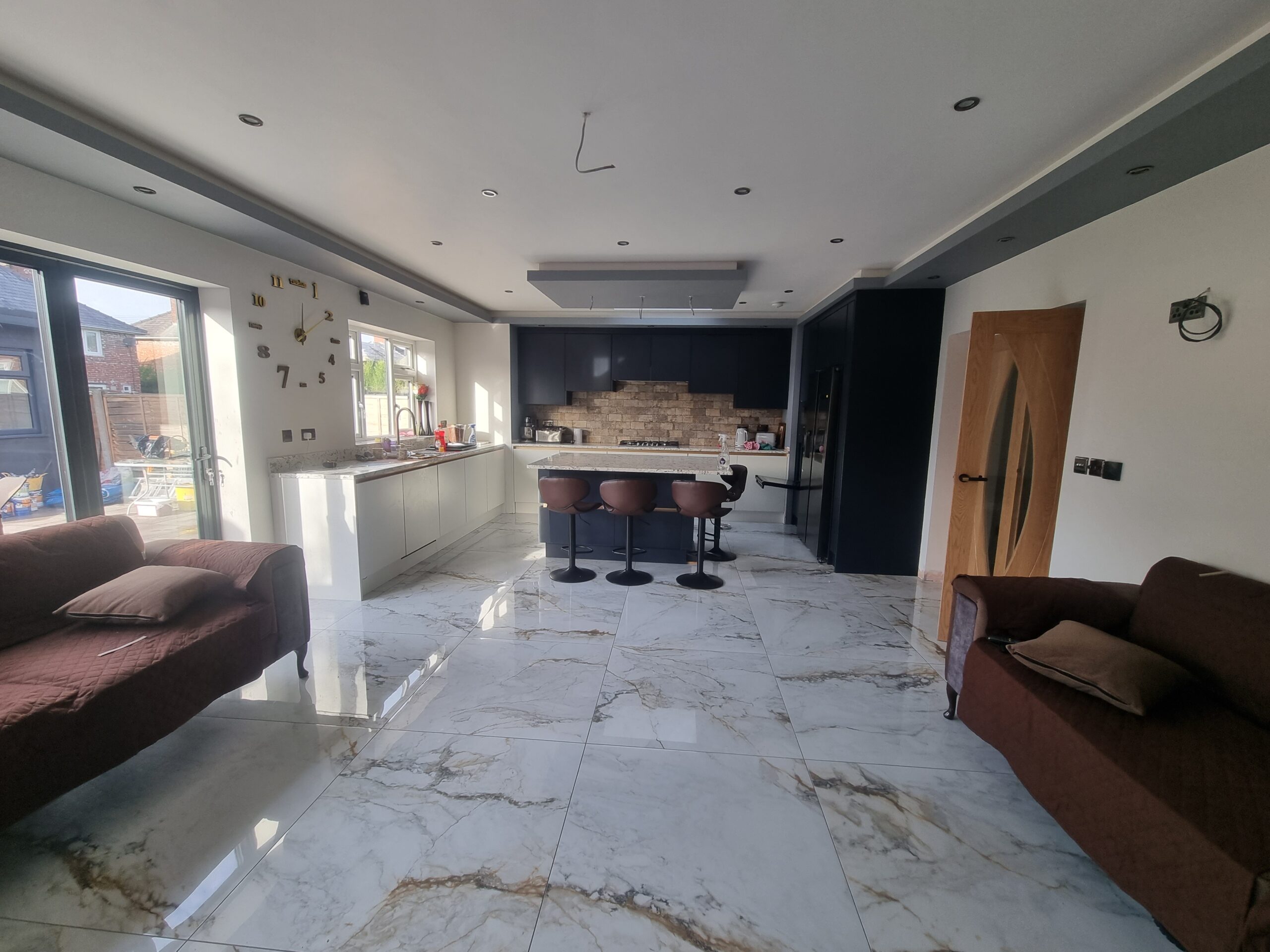 Completed open plan kitchen and living area after house extension by KWS Builders Manchester