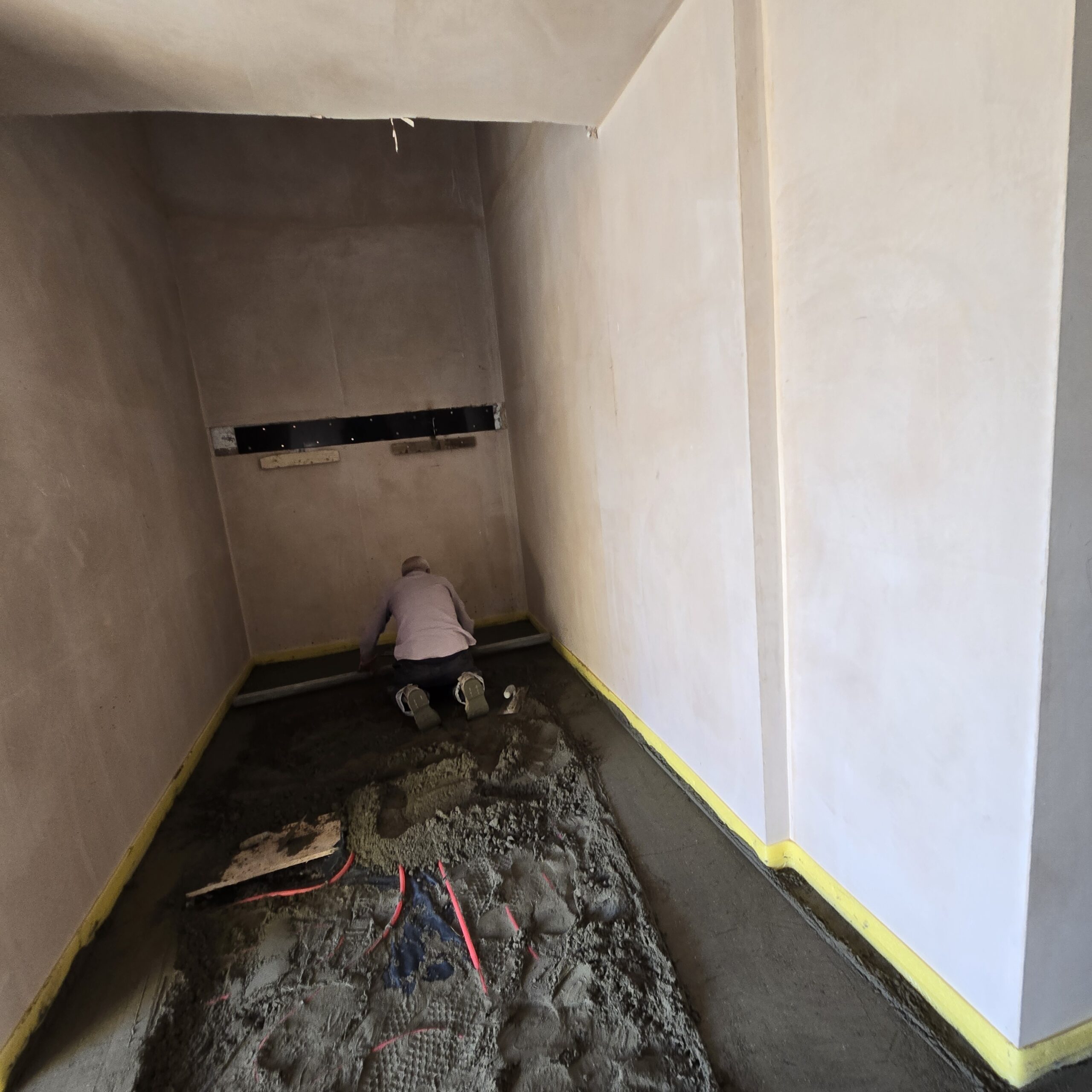 Screed being applied over pipework thumbnail