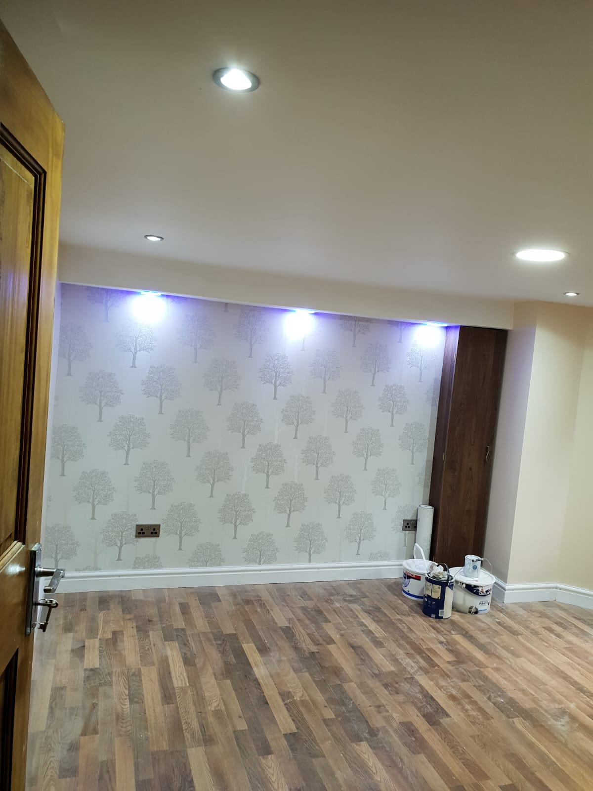 Finished cellar and garage conversion interior by KWS Builders Manchester with clean walls, lighting and usable room finish